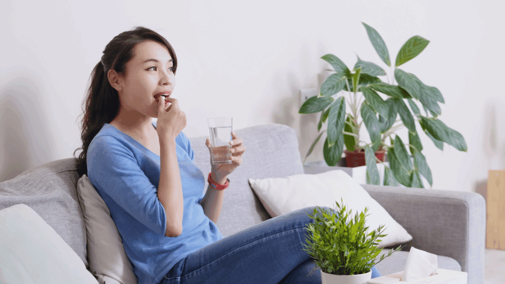 Woman taking pain medication