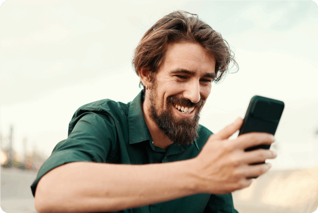 closeup of a young hipster man using a mobile phone