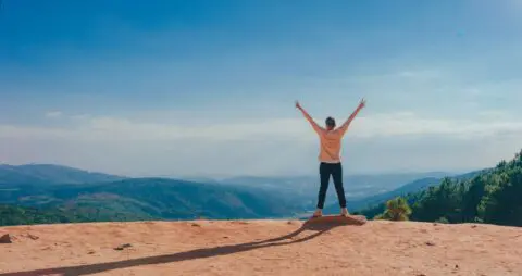Person celebrating outside after mental health advice with counseling services online