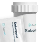QuickMD Suboxone (buprenorphine and naloxone) medication bottle and film strip packet on white background