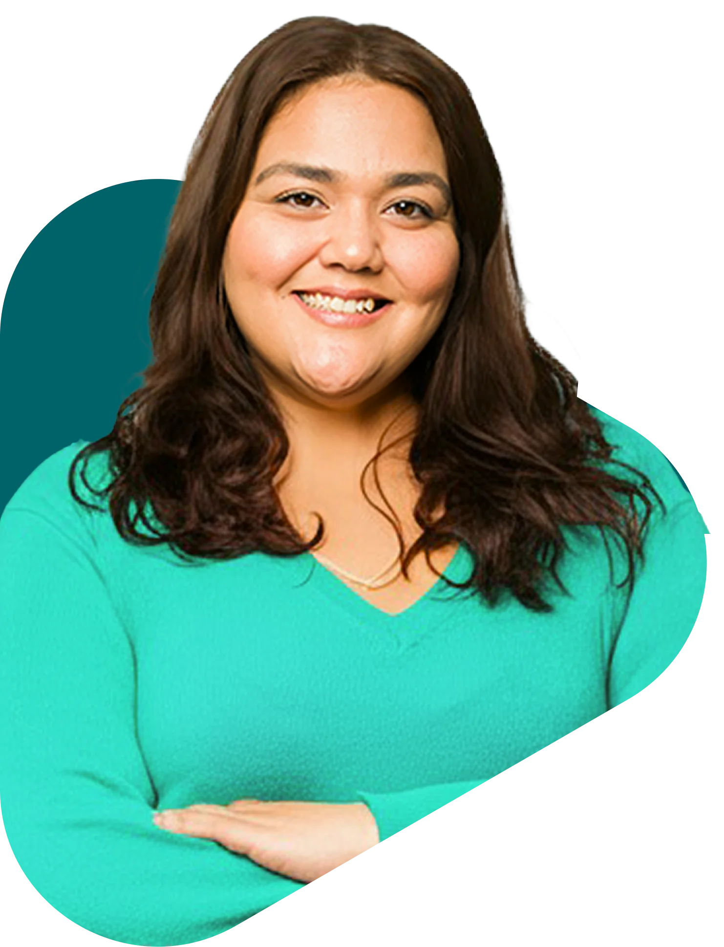 Smiling woman with long brown hair wearing a mint green v-neck sweater, arms crossed confidently