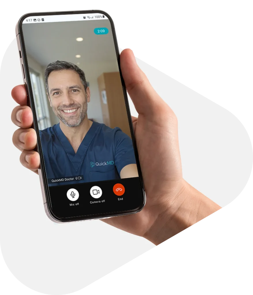 Patient on a QuickMD online video visit with a doctor in blue scrubs