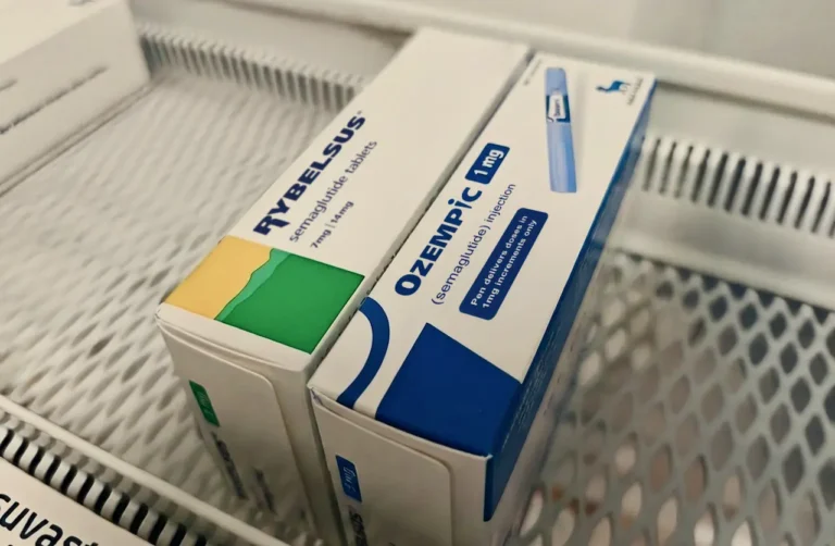 Boxes of Rybelsus tablets and Ozempic injection (semaglutide) side by side on a refrigerator shelf