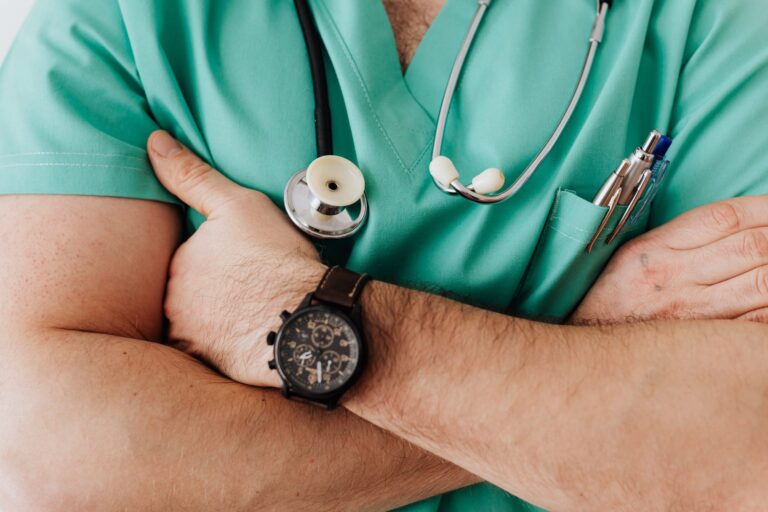 Doctor with a stethoscope crossing his arms