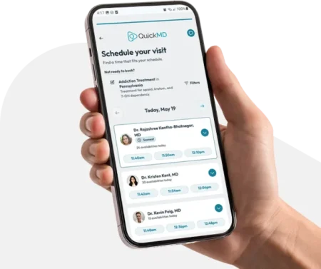 QuickMD app schedule screen with available doctors and time slots