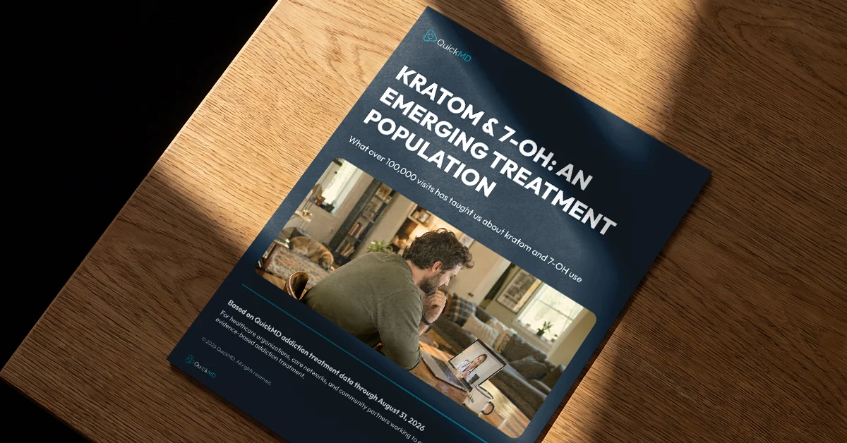 QuickMD white paper titled "Kratom & 7-OH: An Emerging Treatment Population" resting on a wooden surface