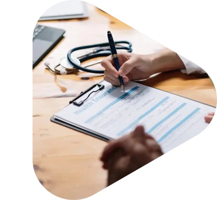 doctor filling out health insurance paperwork