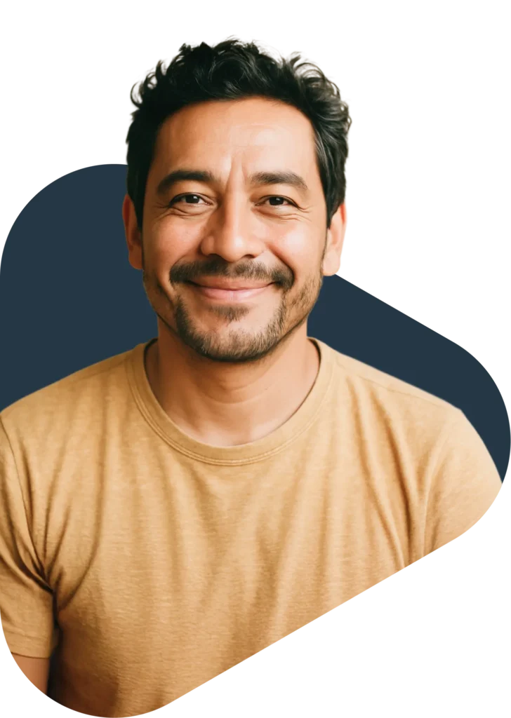 Man smiling in tan shirt